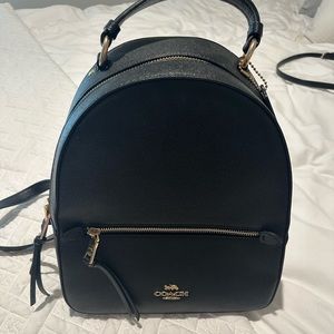 Coach leather black small backpack never used.